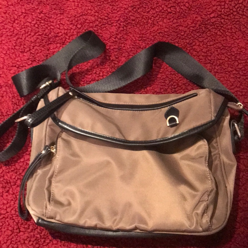 Crossbody or shoulder bag/travel bag. NWOT
